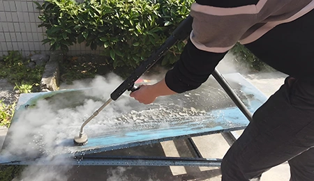 Steam cleaning of metal sheets