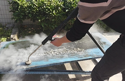 Steam cleaning of metal sheets